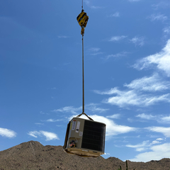 AC unit on a crane being installed